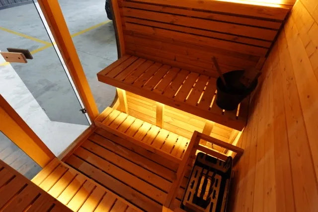Ritual interior — bench levels and Harvia stone heater
